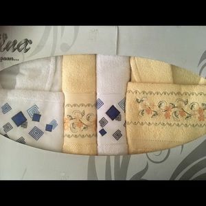 2 bathrobes 2 towels and 2 mini towels